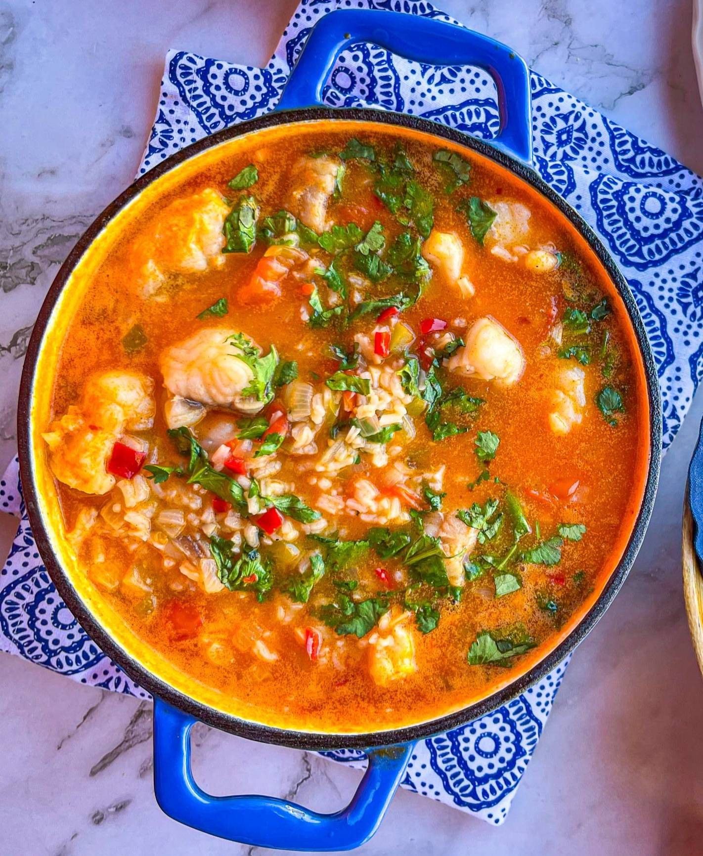 blue pot full of Portuguese fish and rice stew.