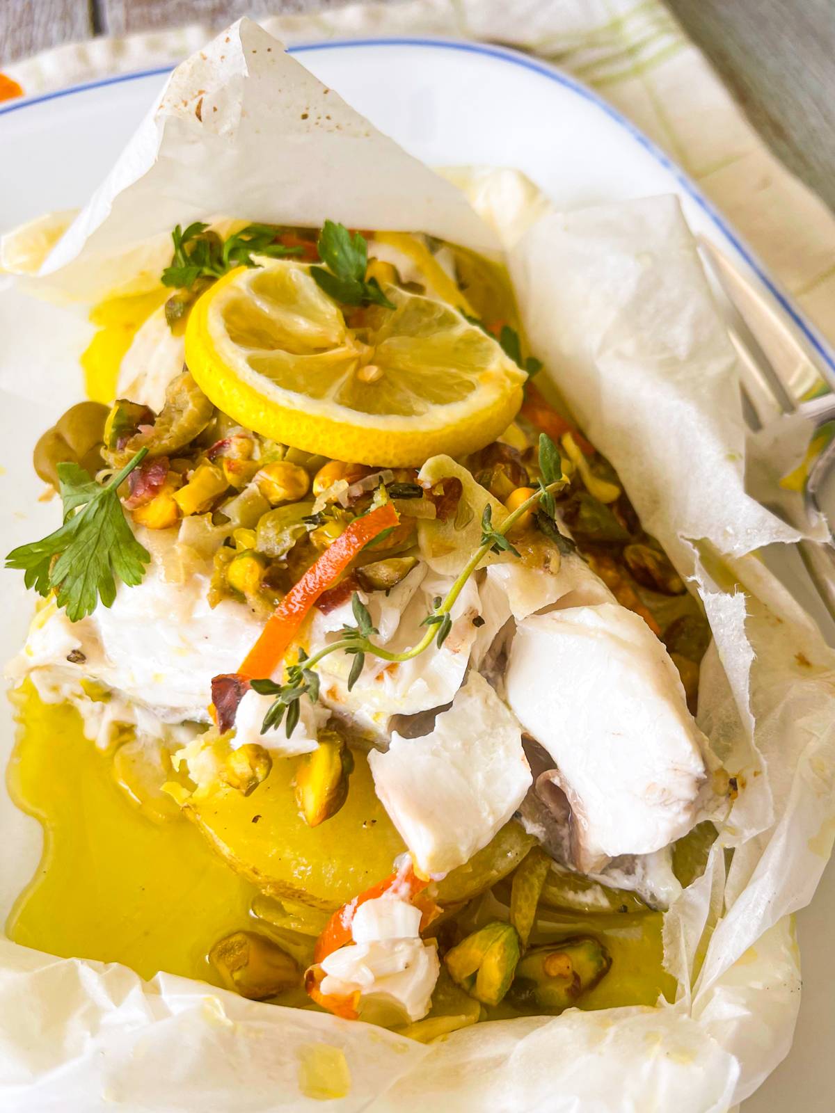 baked grouper with citrus, olives and pistachios.