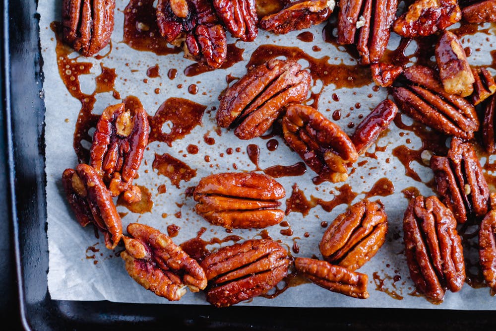 roasted pecans on a baking sheet.