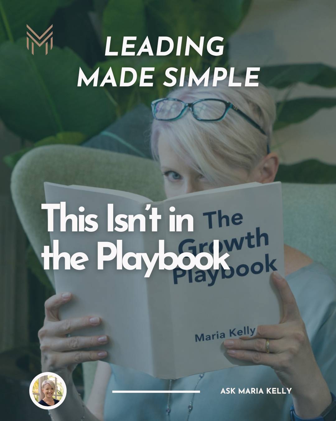 Maria with short looking over a book titled the Growth Playbook.