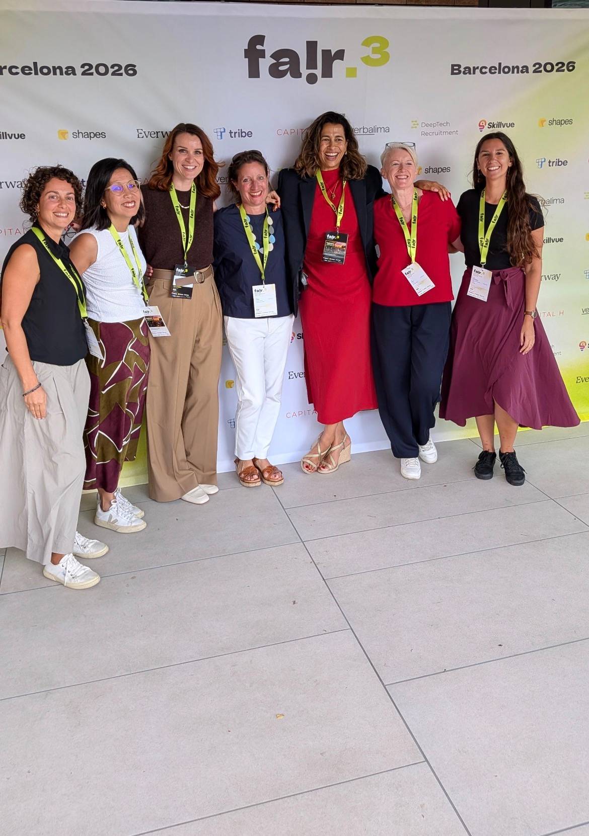 TruthWorks Community: Yeshim, Karla, Rhiannon (co-founder), Suzy, Emily (co-founder), me and Paulina - standing in front of the banner F AIR 2026