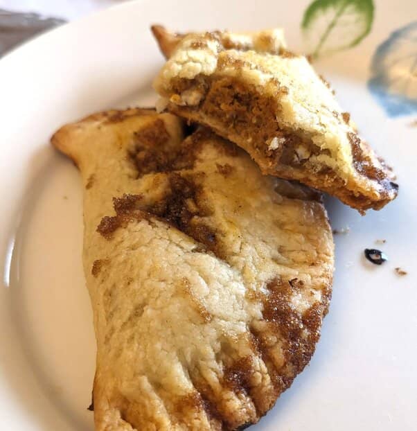 Two pastries displayed on a white plate