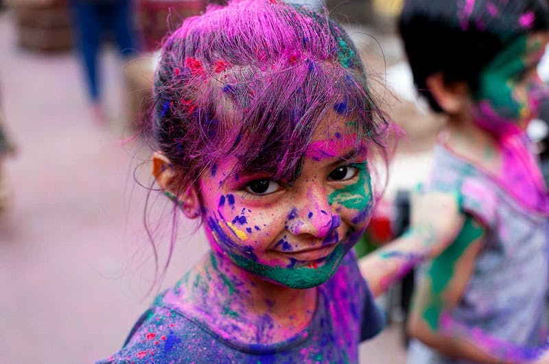 girl with purple and blue paint on face
