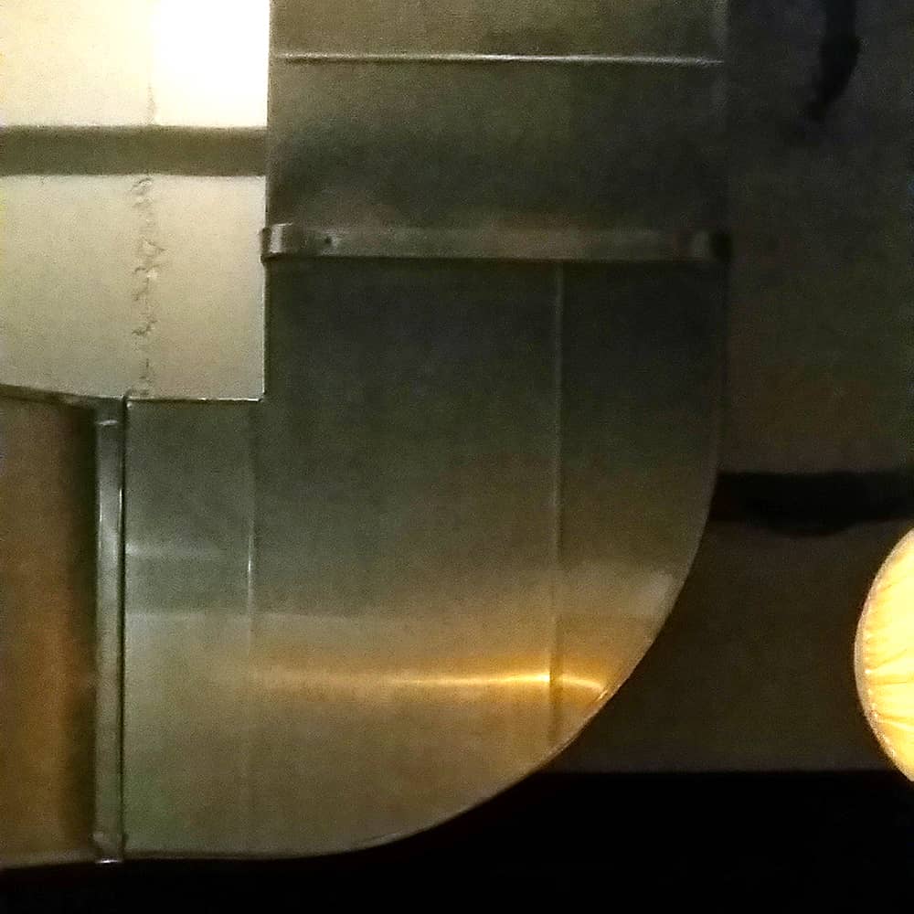 Abstracted photo of ceiling ventilation.