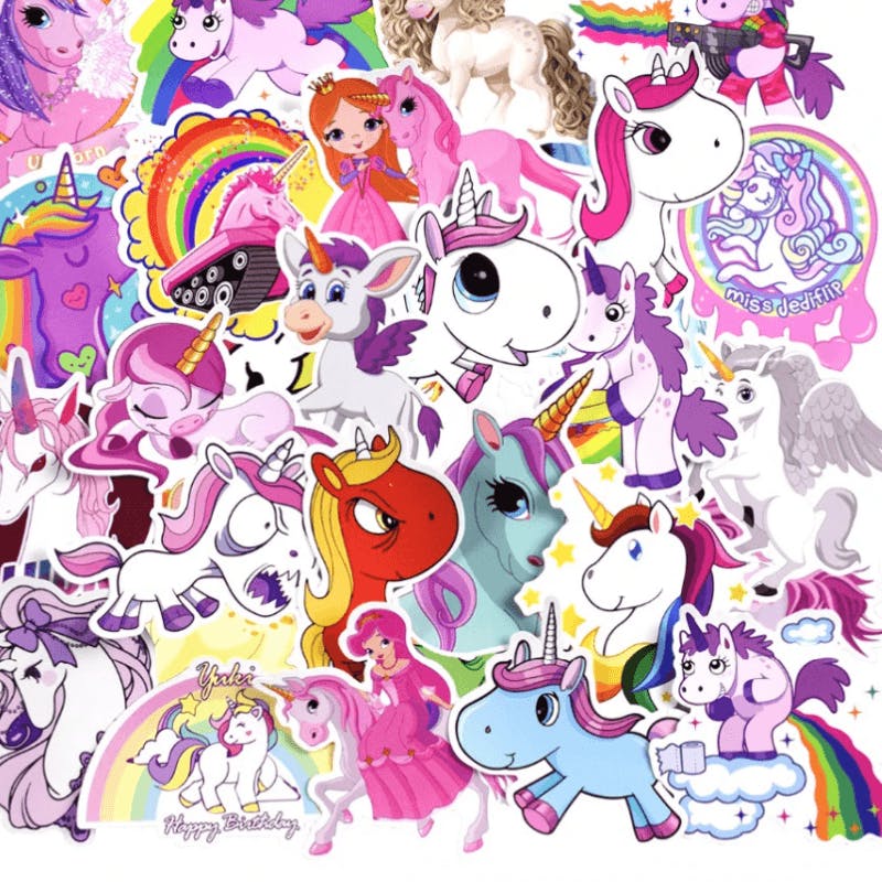 A pile of stickers in the shapes of unicorns, rainbows, and princesses.