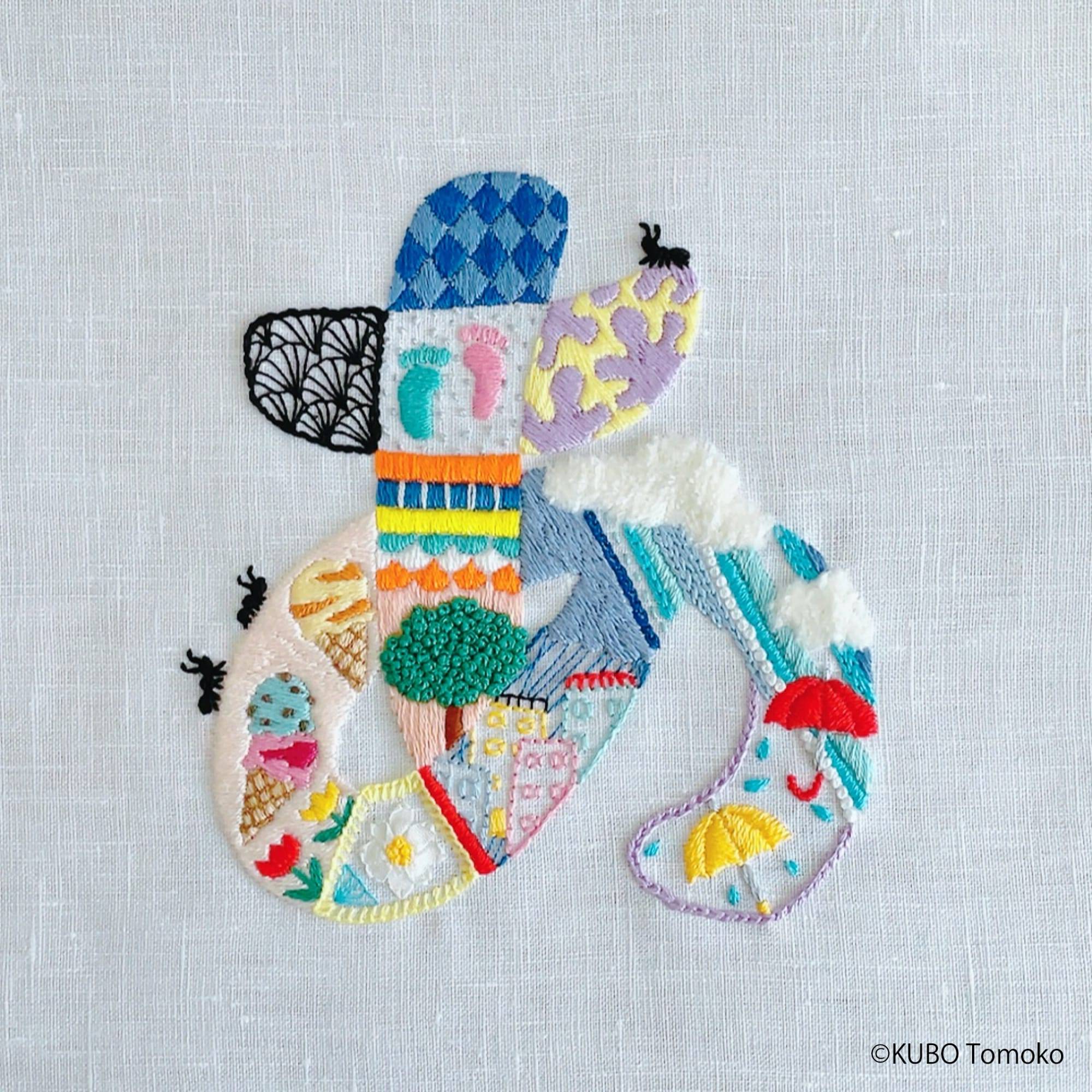 Photo of an embroidered Hiragana character by Tomoko Kubo. The character is embellished with imagery corresponding to the sound this character makes. Via Colossal. Click image to view source.