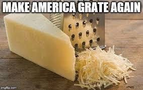 Photo of a block of cheese and a cheese grater on a wooden table next to some shredded cheese. Text reads: MAKE AMERICA GRATE AGAIN