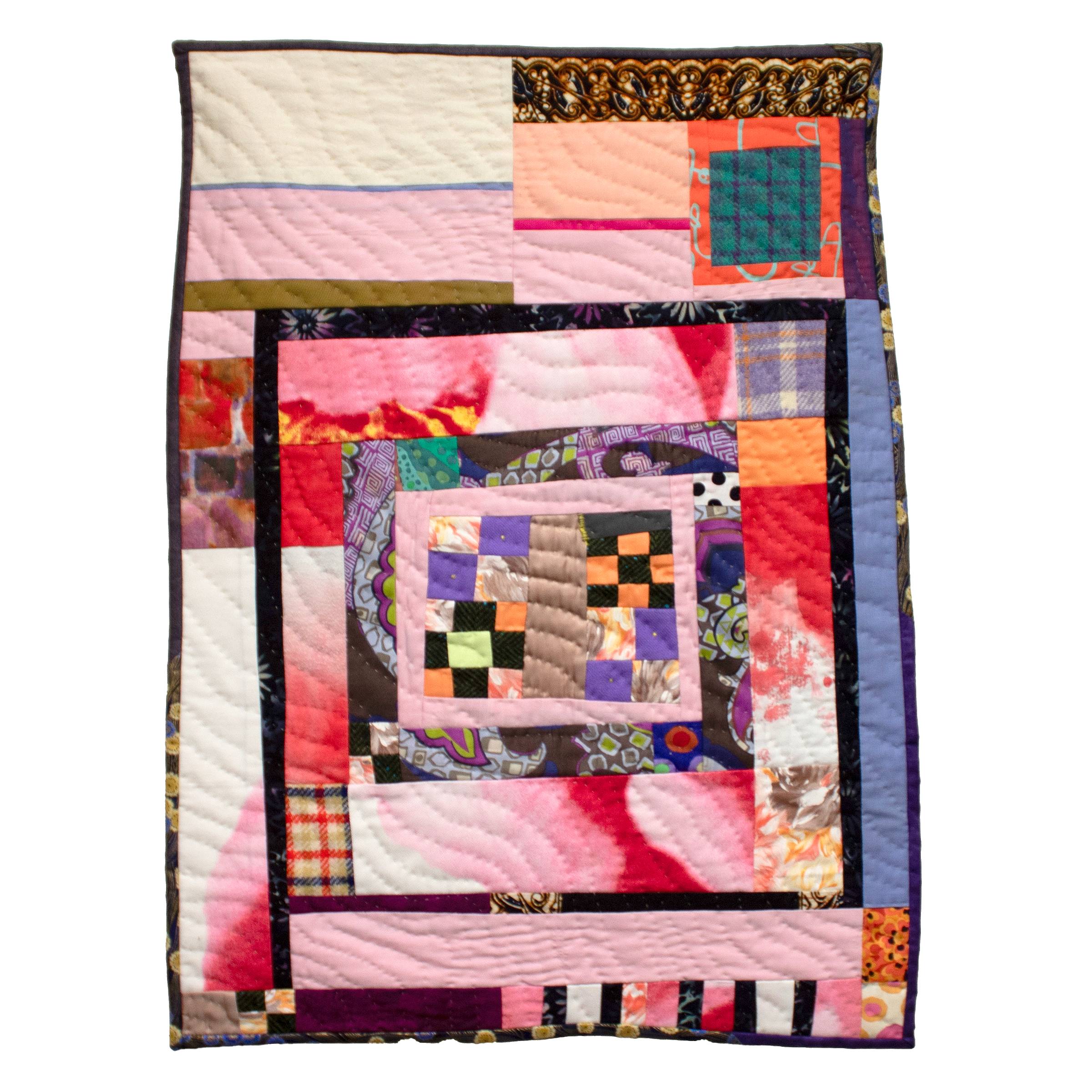 Photo of the small patchwork quilt titled Self Love 1: Horizons Continue Broadening, created by Sarah Atlee. This abstract quilt features fabrics that are pink, purple, orange, green, maroon, brown, and black. The quilt has an irregular rectangle shape. W