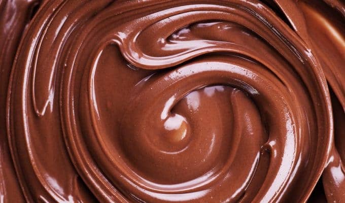 Photo of melted chocolate, swirled in a near-concentric circle.