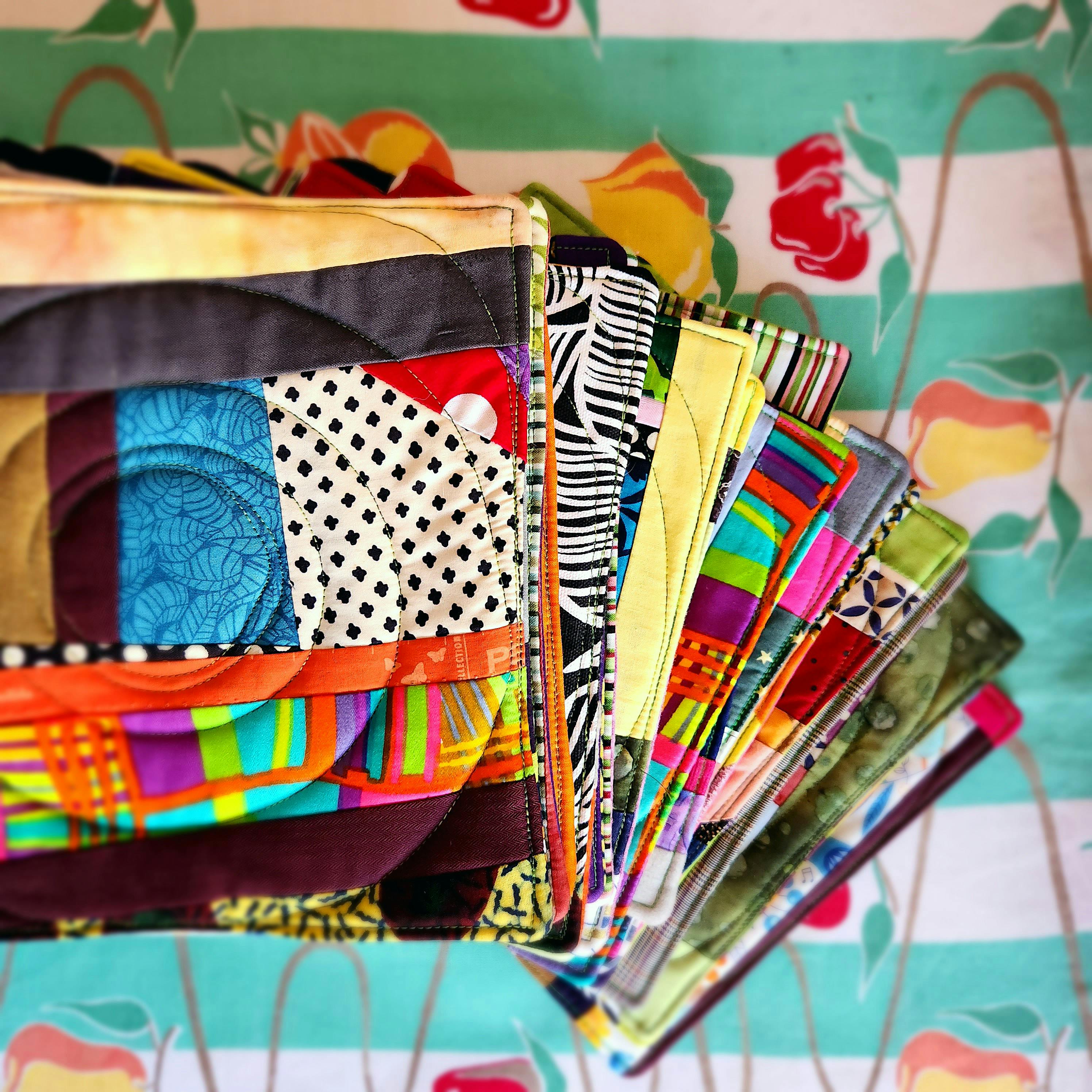 They are sitting on top of a vintage tablecloth with green and white stripes.