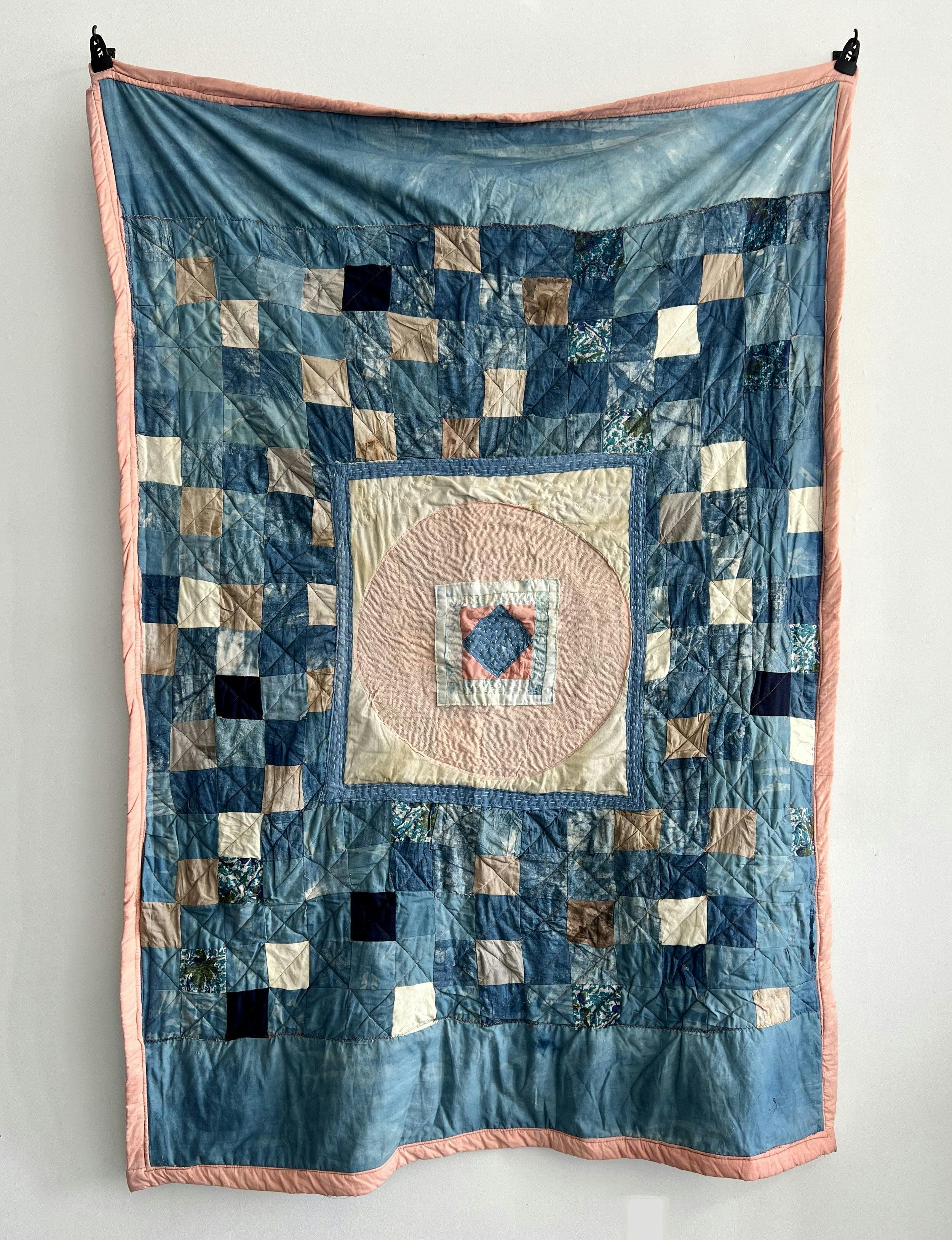 Photo of a patchwork quilt by Cyrah Dardas.