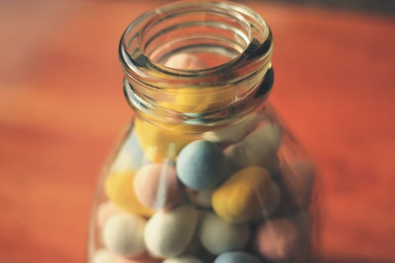 selective focus photo of clear glass bottle