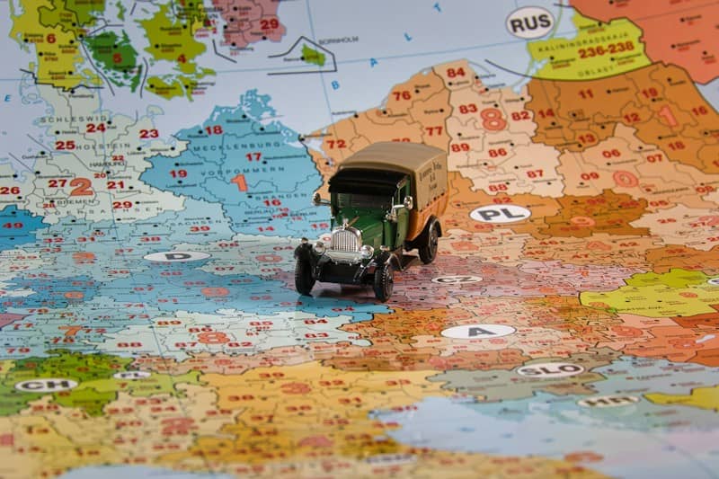 A toy truck travels across europe on a map