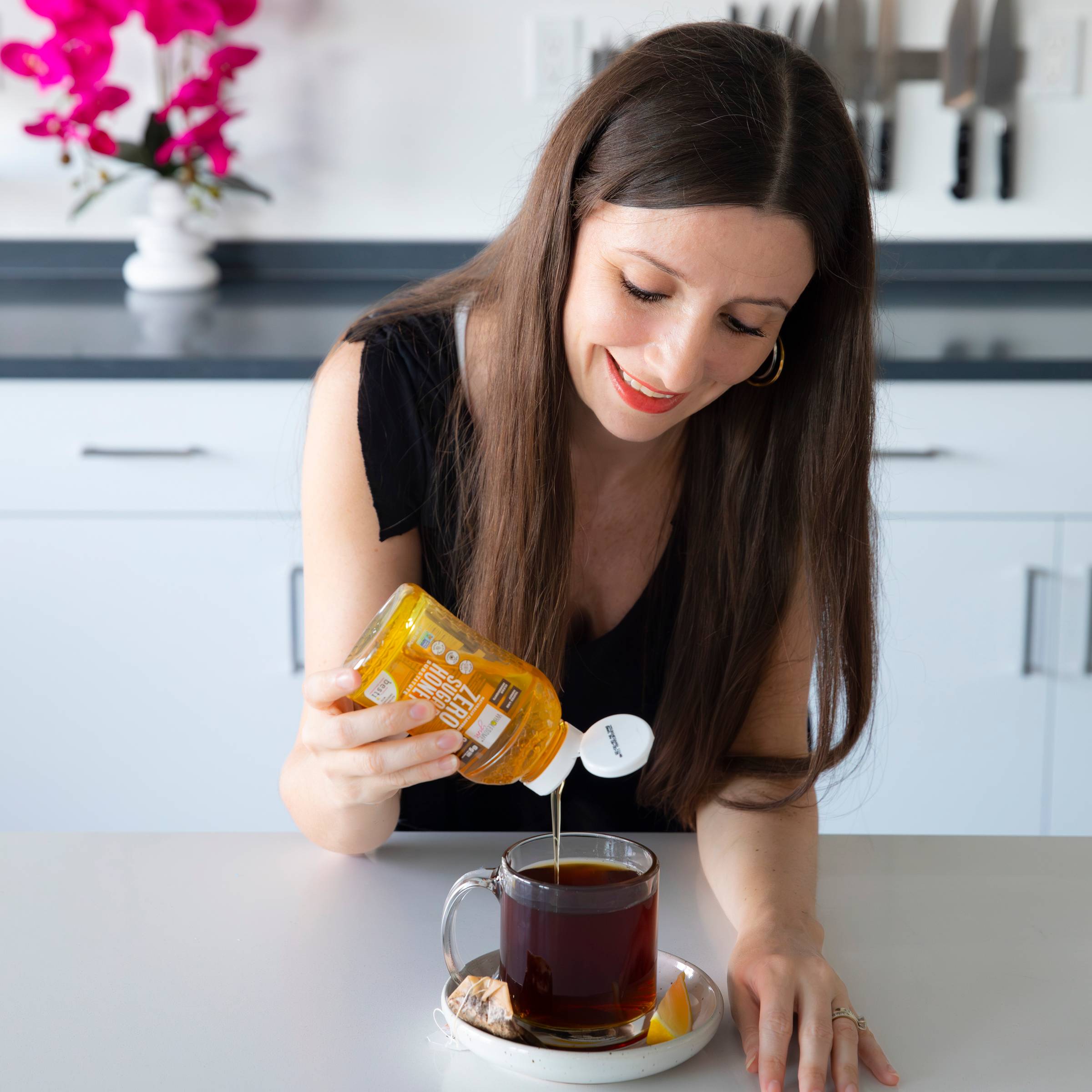 Maya pouring Zero Sugar Honey.
