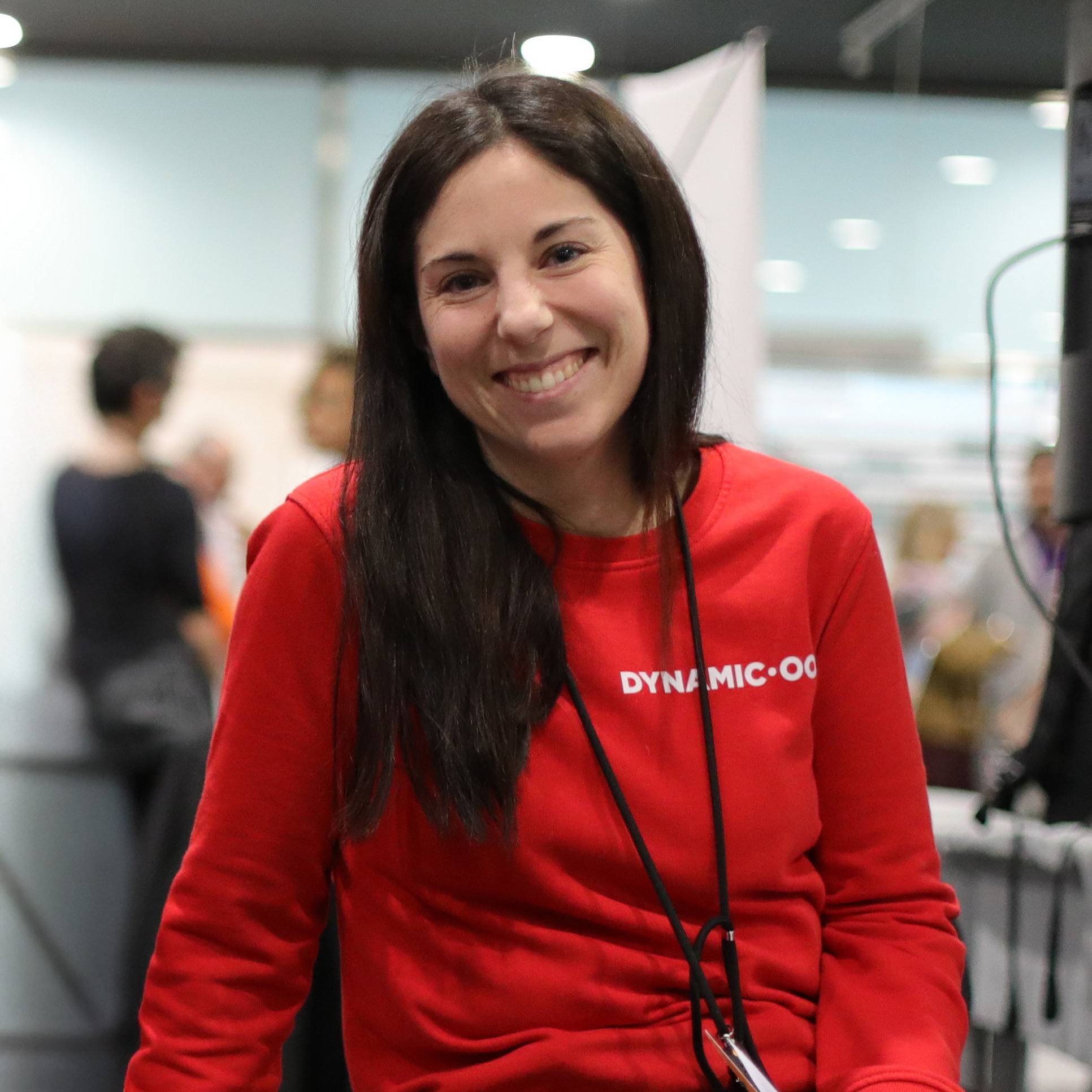 Marta Parisi - woman with long dark hair and a warm smile. 