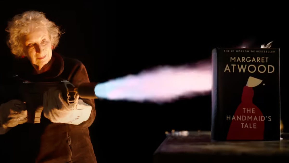 Margaret Atwood with a flamethrower protesting book banning for the Unburnable Project