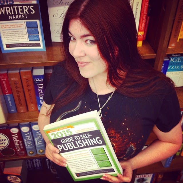 Kat Vancil holding Writer’s Digest Guide to Self-Publishing 2015 at Santa Clara Barnes and Noble