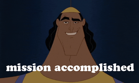 Movie GIF Kronk from the Emperor’s New Groove looks at us and says, “Mission Accomplished” with a satisfied look on his face
