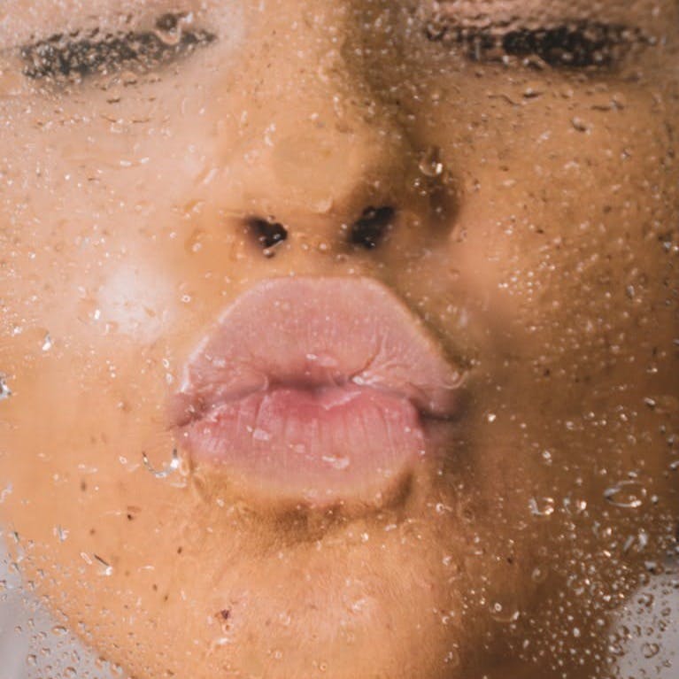 woman in water with water droplets