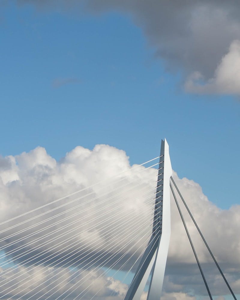 white suspension bridge under white cloud