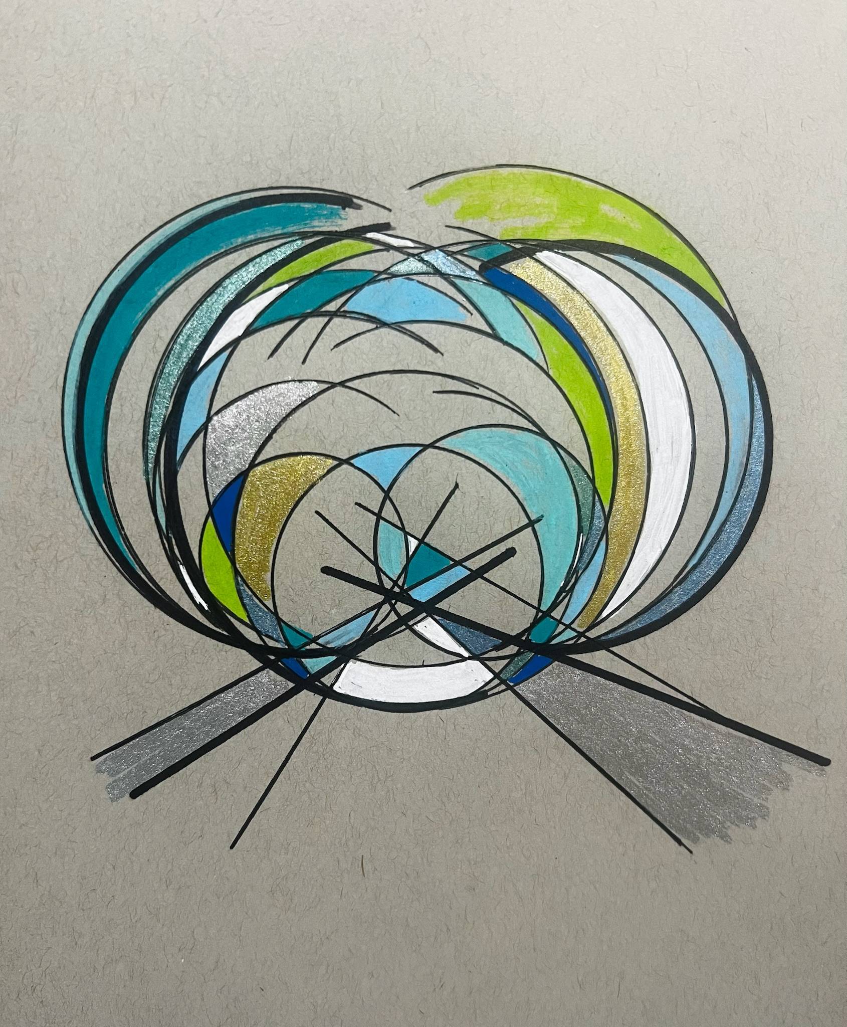 Abstract hand-drawn design made of overlapping circular arcs and lines. The shapes form a layered, swirling pattern in shades of teal, blue, green, white, gold, and silver. Several thin black lines intersect across the lower center, creating a geometric focal point. The drawing sits on textured off-white paper with a minimal background.