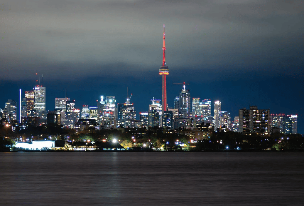 Toronto, Ontario, skyline at night. https://www.pexels.com/photo/stunning-night-view-of-toronto-skyline-and-cn-tower-29422607/