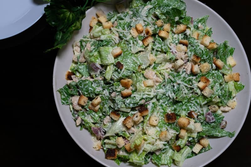 A delicious caesar salad, ready to be eaten!