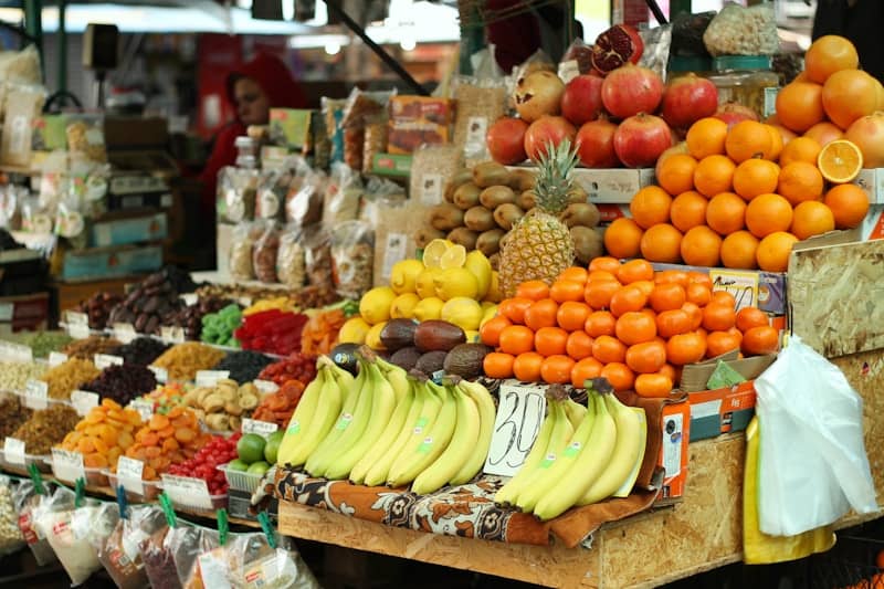 Fresh fruits are on display at a market.