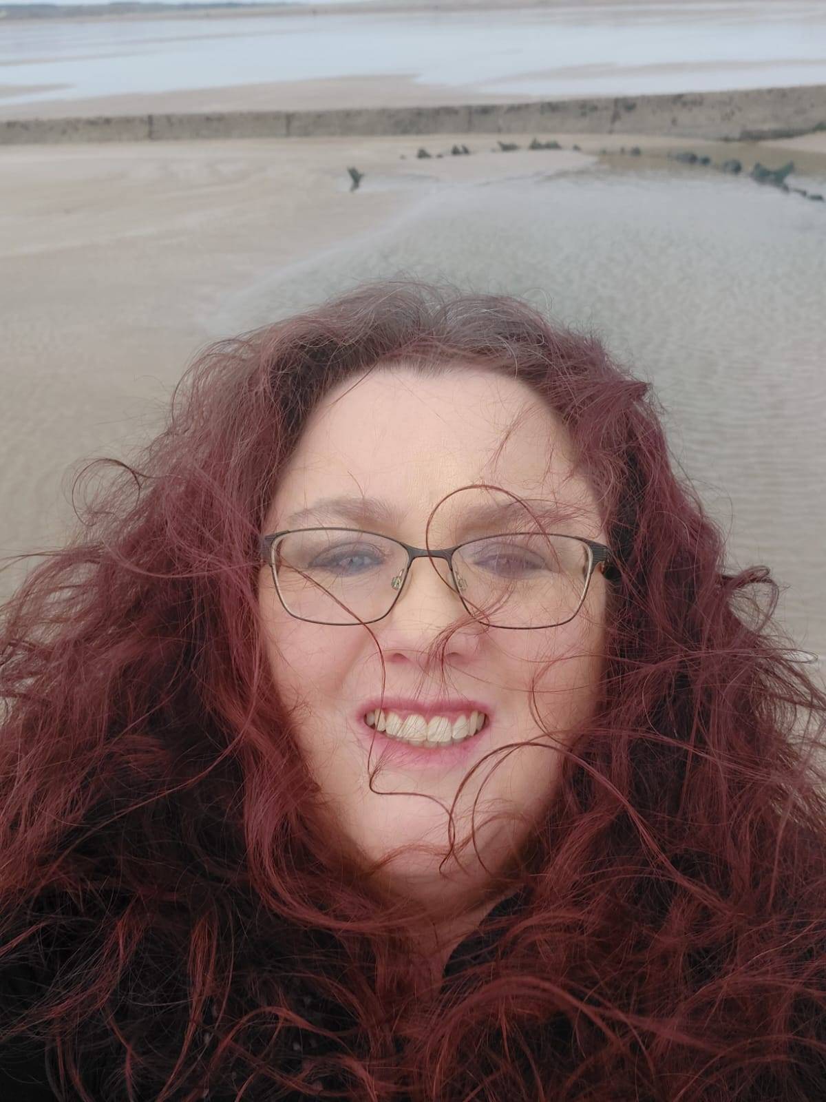 Me at the beach, in the wind, experiencing some joy. Also my hair all over my face! Sometimes joy as a daily practice takes effort!