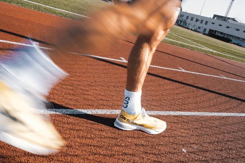 Runner's legs in motion on a track