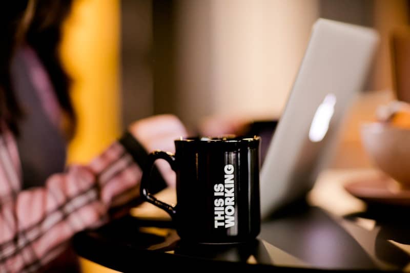 black ceramic mug on black table