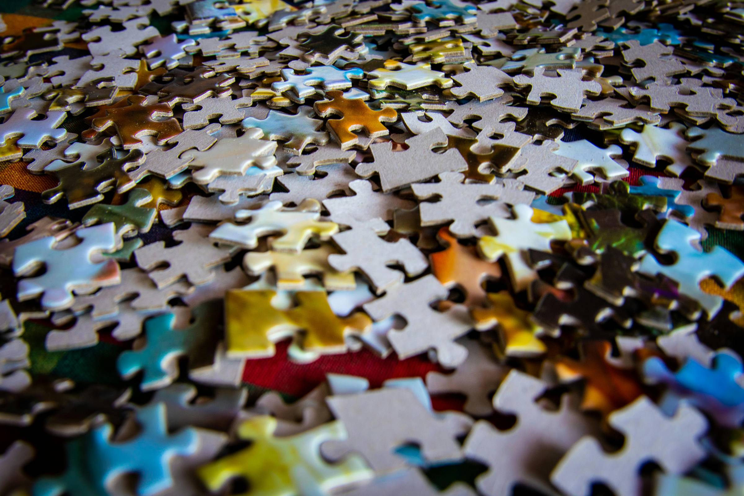 Scattered jigsaw puzzle pieces