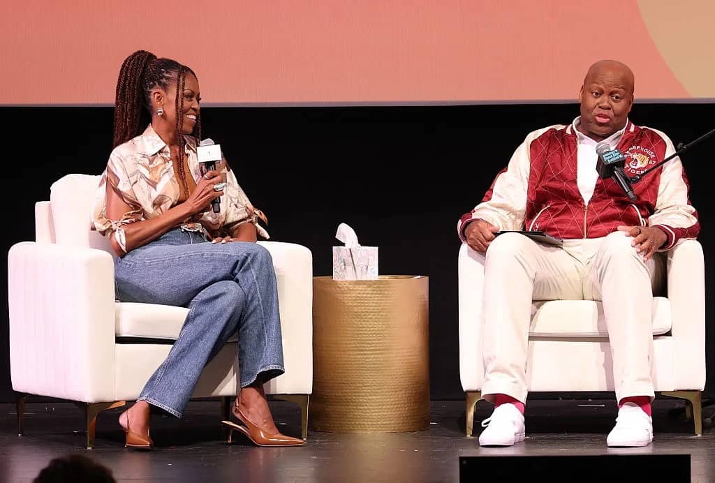 Michelle Obama and her brother Craig Robinson talk about their life on stage