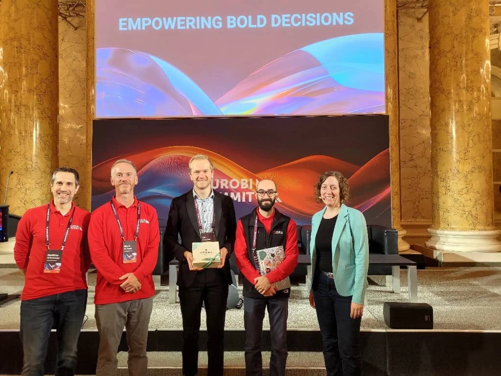 uTim Varelmann celebrating his win at Gurobi's Tuning Challenge with an original Sachertorte