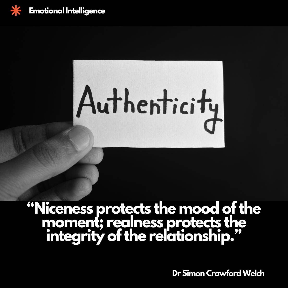 Visual description: A black and white photograph on a black background showing a hand holding a small white card between thumb and fingers, the word Authenticity written across it in bold handwritten marker. Concept: Authenticity is small enough to hold in one hand and heavy enough to change every relationship you carry it into, because being real costs more in the moment than being pleasant. Quote on image: "Niceness protects the mood of the moment; realness protects the integrity of the relationship." By Dr Simon Crawford Welch