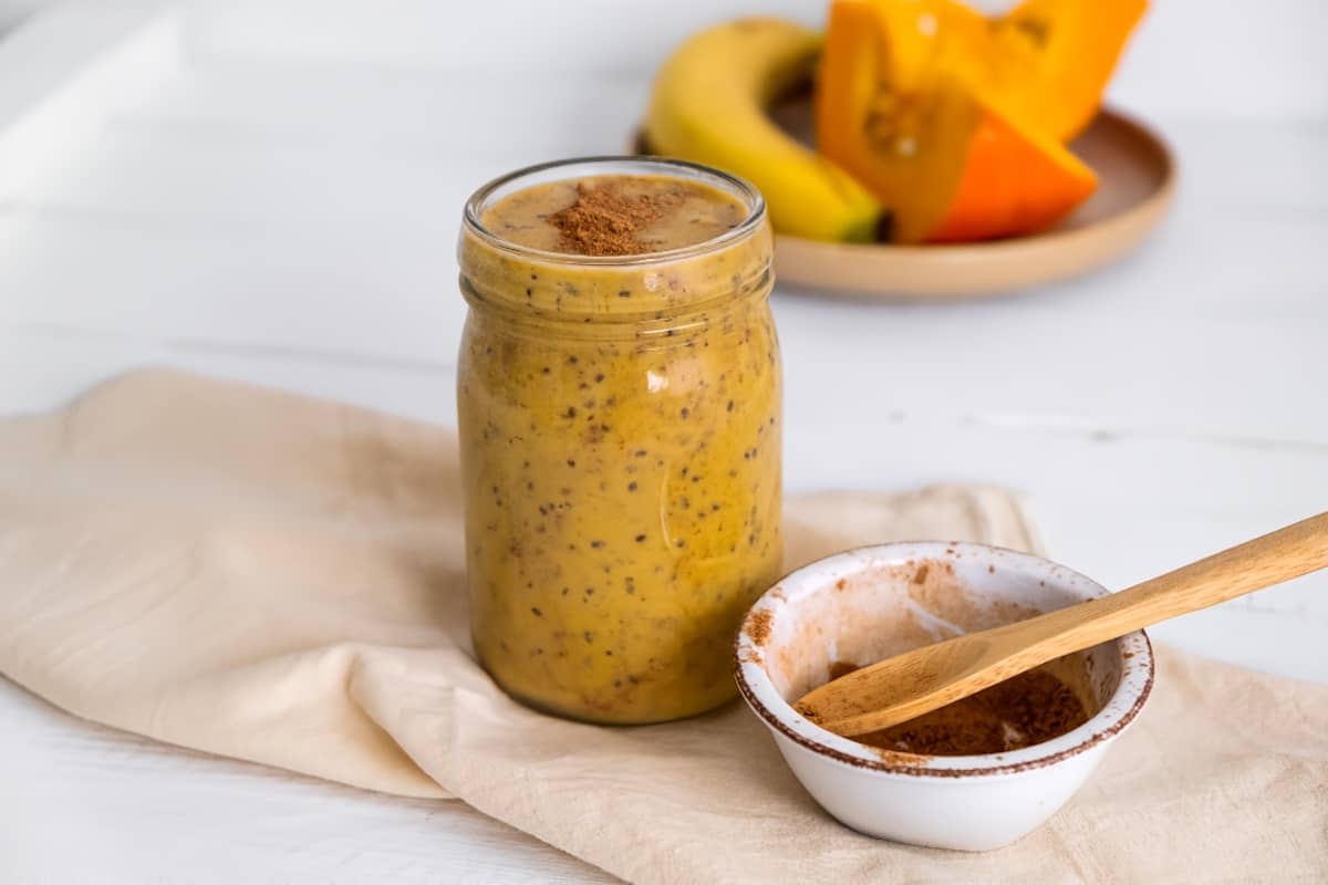 pumpkin smoothie on white counter