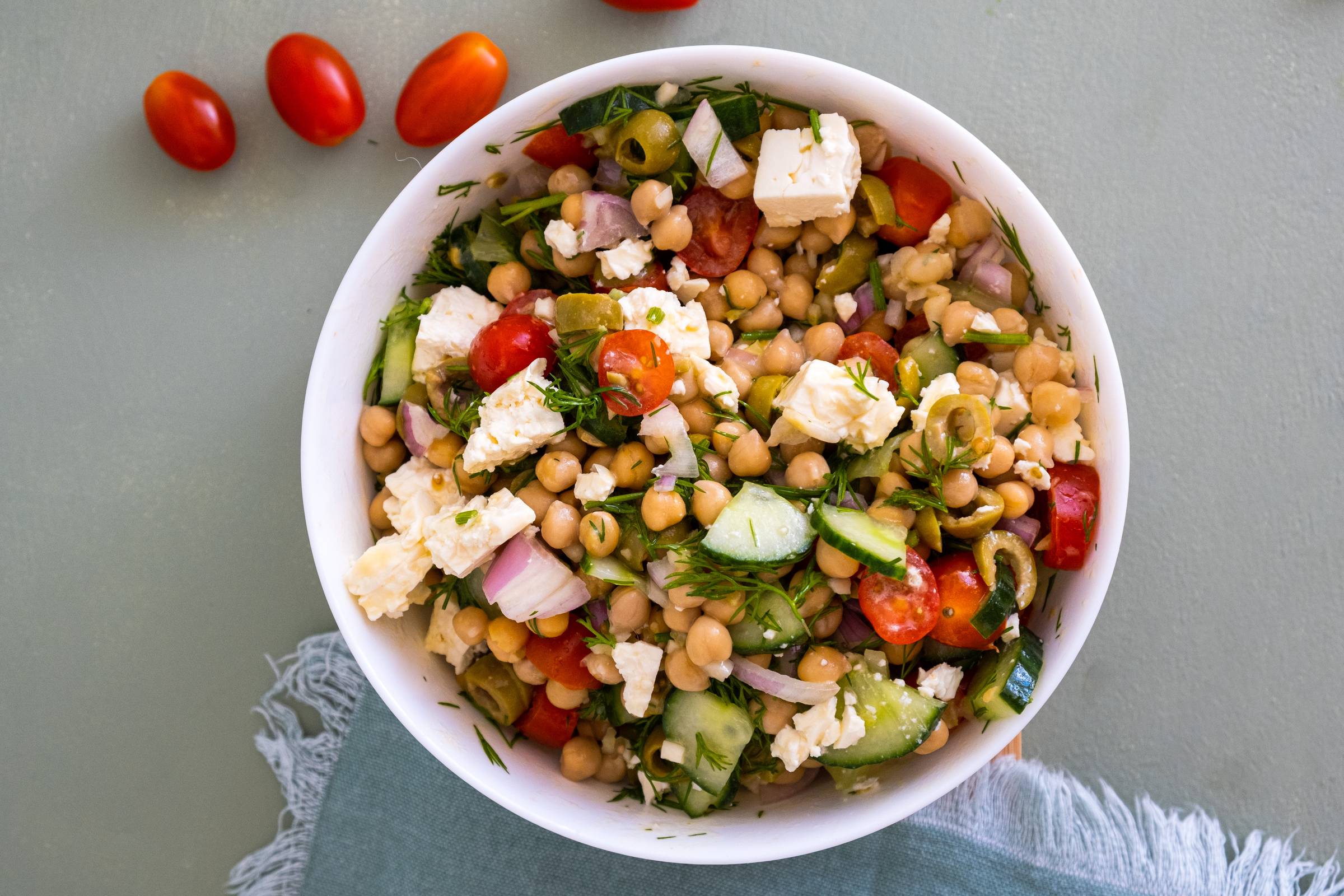 chickpea cucumber salad in white bowl