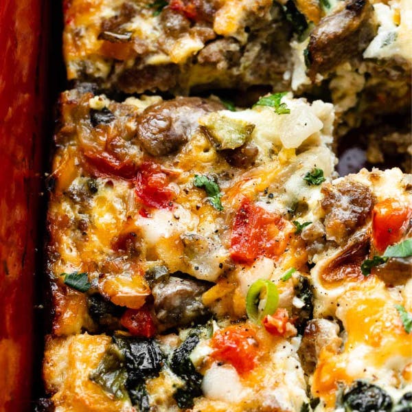 cut up breakfast casserole in a red dish