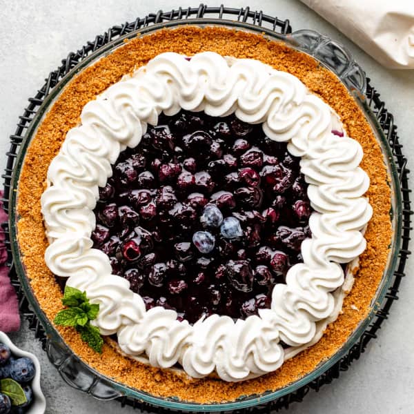 Blueberry cream cheese pie with whipped cream topping