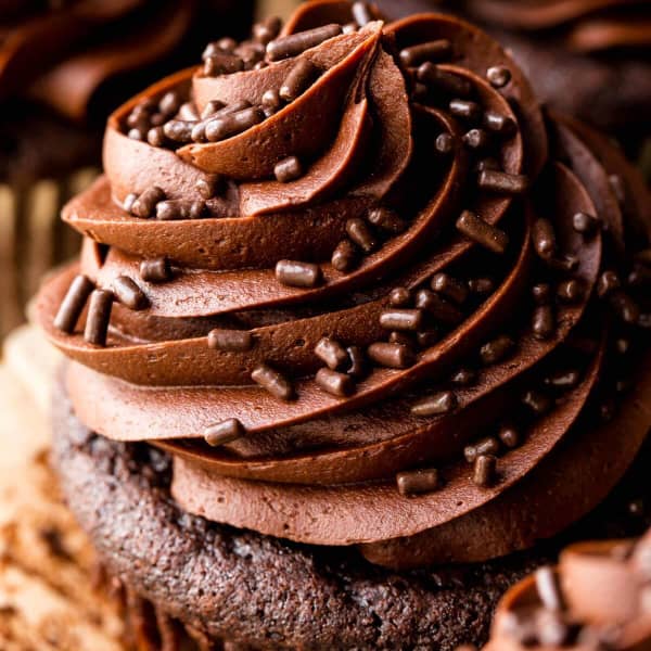 chocolate buttercream piped high on a chocolate cupcake