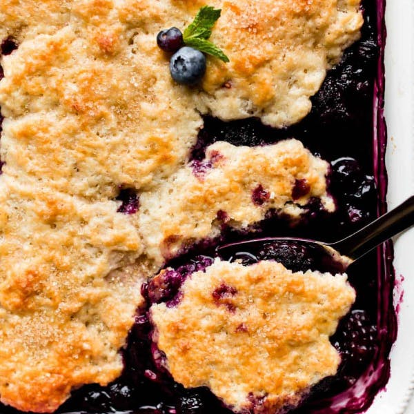 berry cobbler with serving spoon