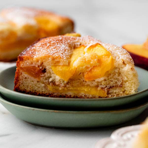 slice of peach cake on green plate