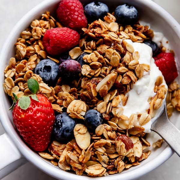 granola in bowl with yogurt and berries