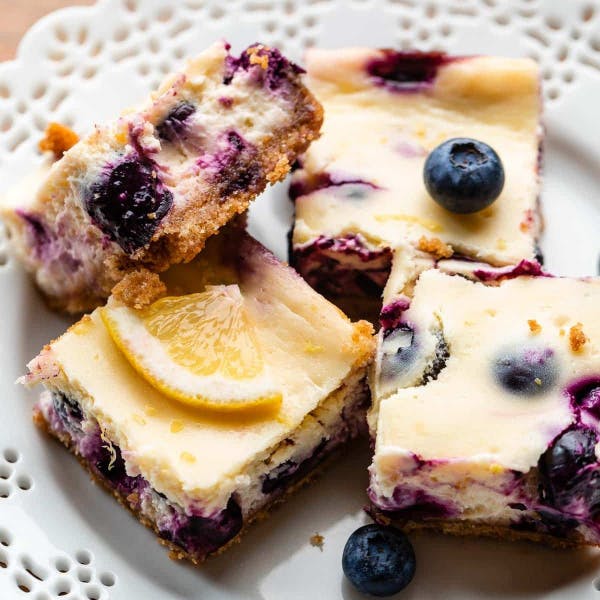 lemon blueberry cheesecake bars on plate