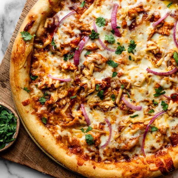 bbq chicken pizza with a side of cilantr