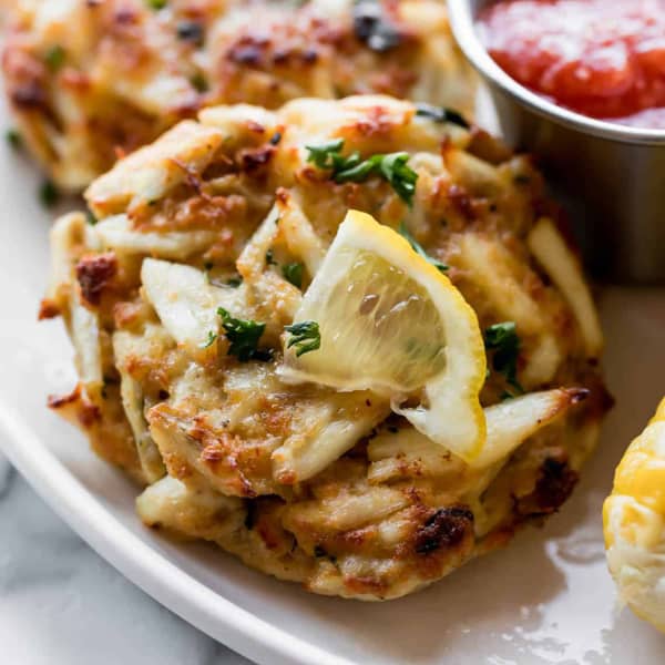 crab cake garnished with lemon and parsley