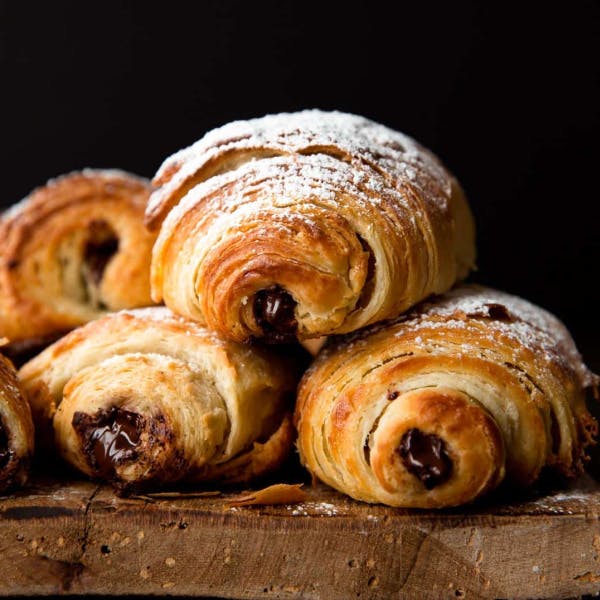 three flaky croissants filled with chocolate