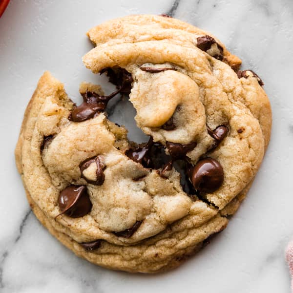 picture of one chocolate chip cookies broken in half