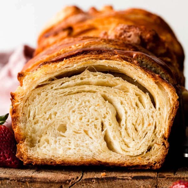 croissant bread sliced to show flaky layers