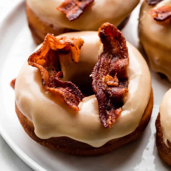 Maple doughnut topped with crispy bacon